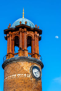 Low angle view of building against clear blue sky