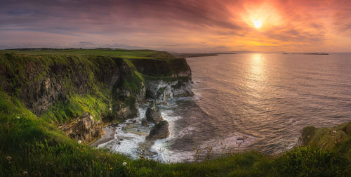 Wide panorama with beautiful white, limestone cliffs at dramatic sunset, northern ireland