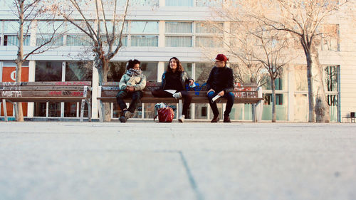 People seat on street