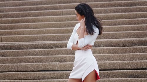 Woman standing on staircase