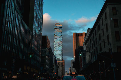 Panoramic view of buildings in city against sky