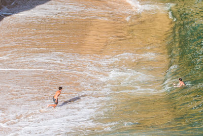 High angle view of man surfing in sea