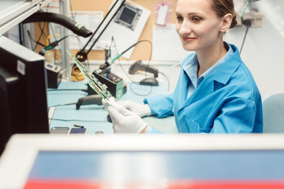 Portrait of woman working on table