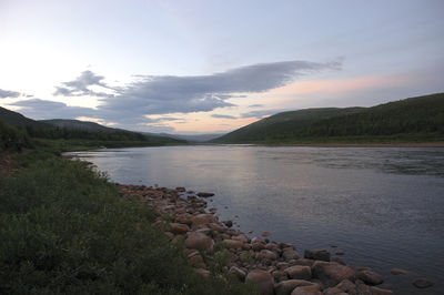 Scenic view of lake at sunset