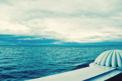 Scenic view of sea against cloudy sky