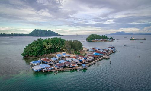 High angle view of boats in sea against sky