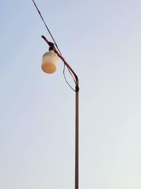 Low angle view of street light against sky