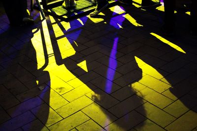 Shadow of people on tiled floor