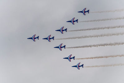 Low angle view of airshow in sky