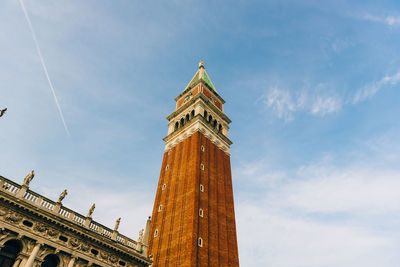 Low angle view of clock tower against sky