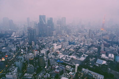 High angle view of modern buildings in city against sky