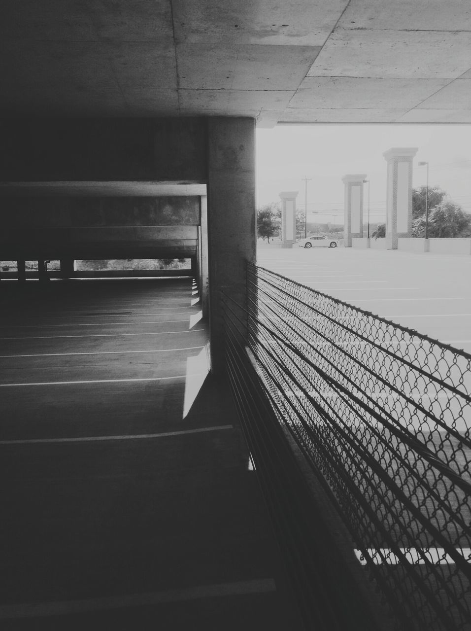 built structure, architecture, indoors, railing, transportation, empty, modern, connection, building exterior, sunlight, no people, city, railroad station, day, railroad station platform, railroad track, shadow, the way forward, ceiling, high angle view