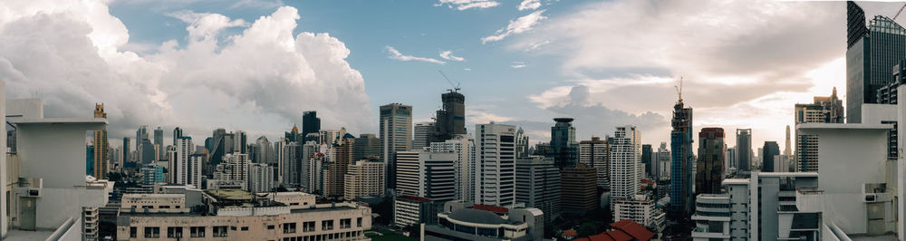 Panoramic view of city buildings against sky