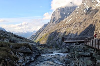 Scenic view of mountains against cloudy sky