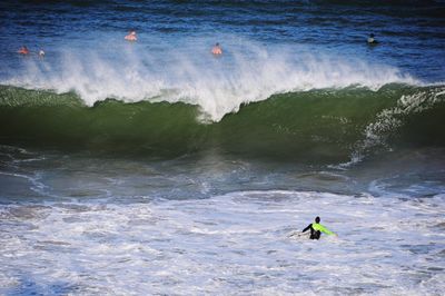 High angle view of man surfing in sea