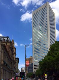 Low angle view of building against cloudy sky