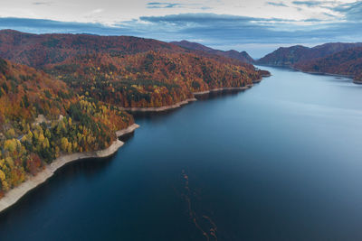 Scenic view of lake against sky during autumn