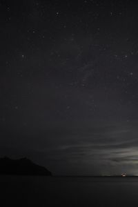 Scenic view of sea against sky at night