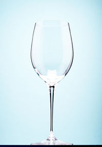 Close-up of wineglass against white background