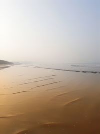 Scenic view of beach against clear sky