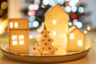 Close-up of illuminated christmas decoration on table