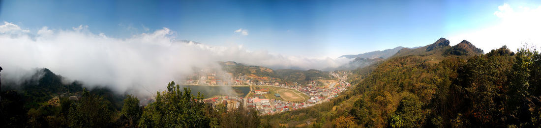 Panoramic view of trees on landscape against sky