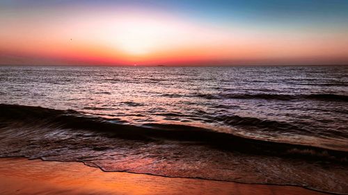 Scenic view of sea at sunset