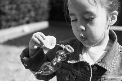 Portrait of girl holding outdoors