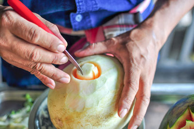 Midsection of man preparing food