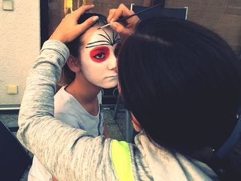 Portrait of friends holding camera