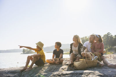 Family relaxing at sea