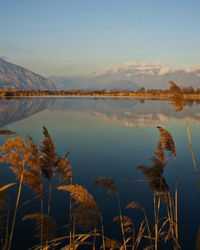 Scenic view of lake against sky during sunset