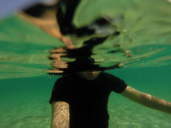 Woman swimming in sea