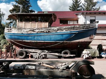 View of boats moored against sky