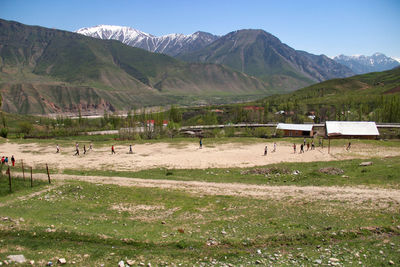 Scenic view of field against mountains