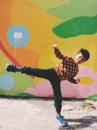 Full length of woman standing on bench