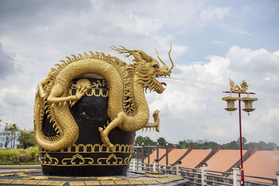 Low angle view of statue against sky