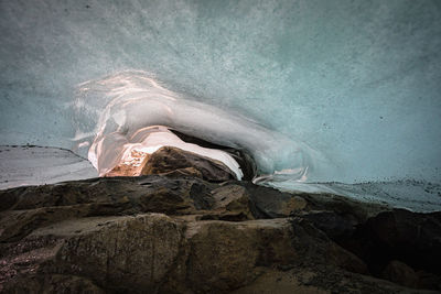 Water flowing through rocks on land