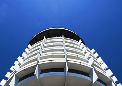 Low angle view of building against clear blue sky