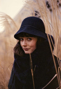 Portrait of beautiful young woman in hat