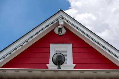 Low angle view of clock tower against building