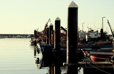 Boats moored at harbor