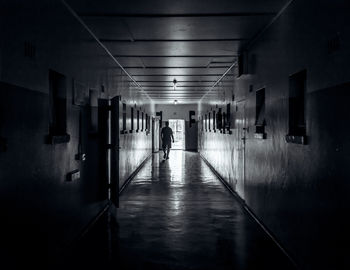 Man in illuminated corridor