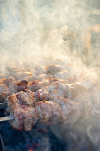 Close-up of meat on barbecue