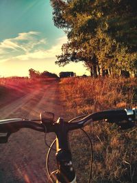 Close-up of bicycle on road against sky