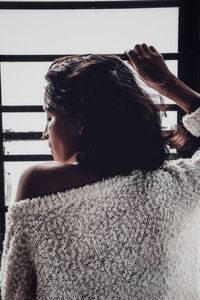 Rear view of woman at home