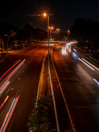 High angle view of light trails on road at night