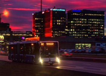 Illuminated city against sky at night