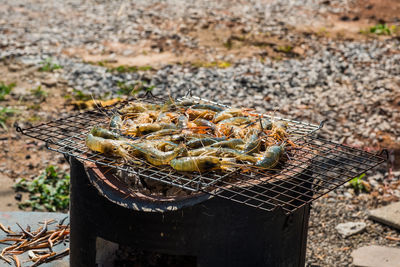 High angle view of meat on barbecue grill