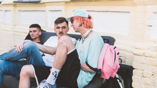 Young men sitting outdoors